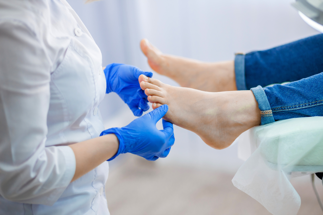 Patient receiving ankle specialist treatment for sports injury recovery.